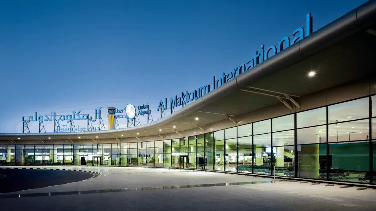 Al Maktoum Airport Expansion Property: The illuminated main entrance of Al Maktoum International Airport in Dubai South, indicating high demand for nearby residential and commercial real estate by Casttio.