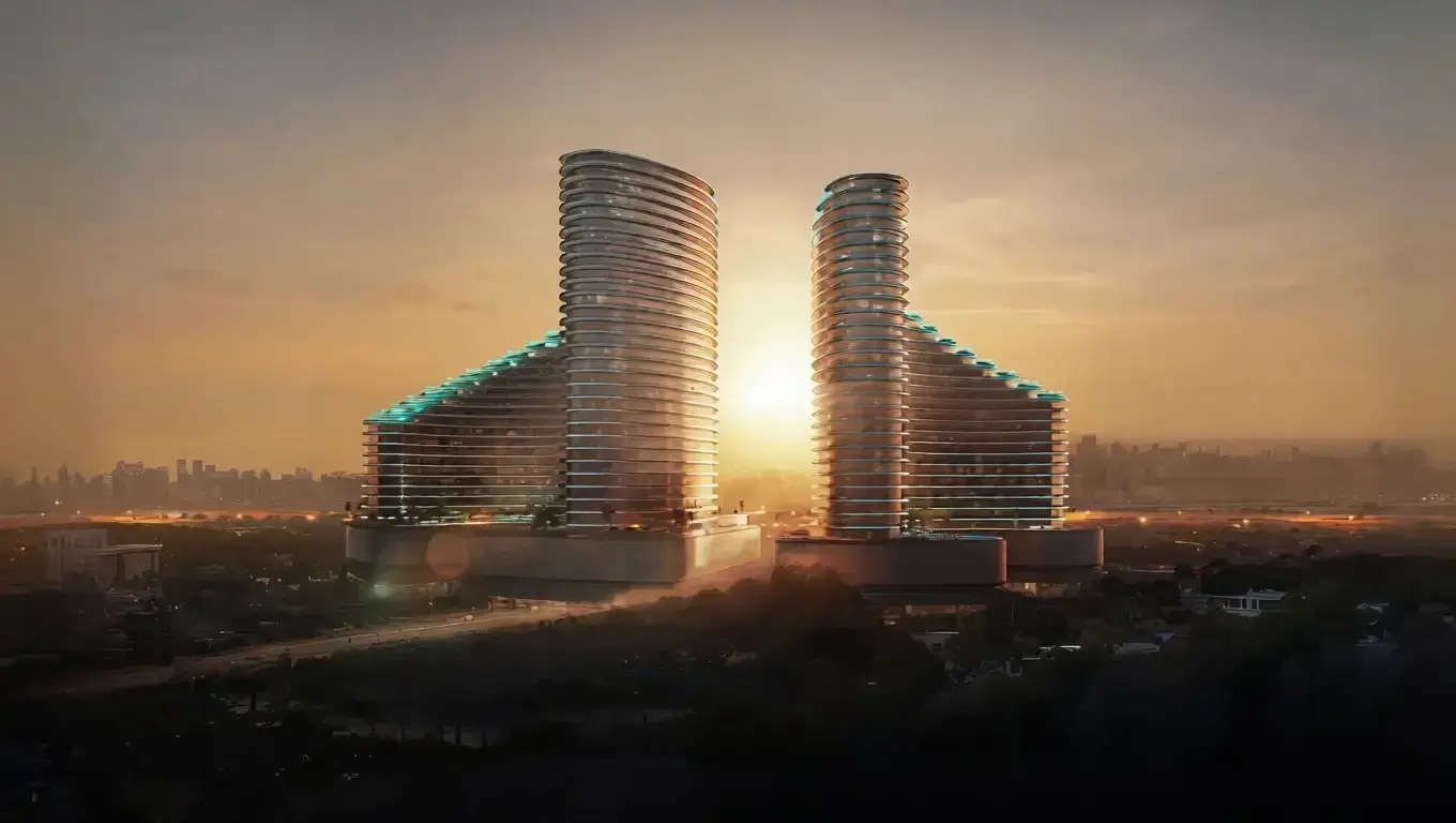 Golden hour sunset illuminating the Binghatti Skyflame twin towers in Majan, representing a tranquil and luxurious suburban lifestyle.