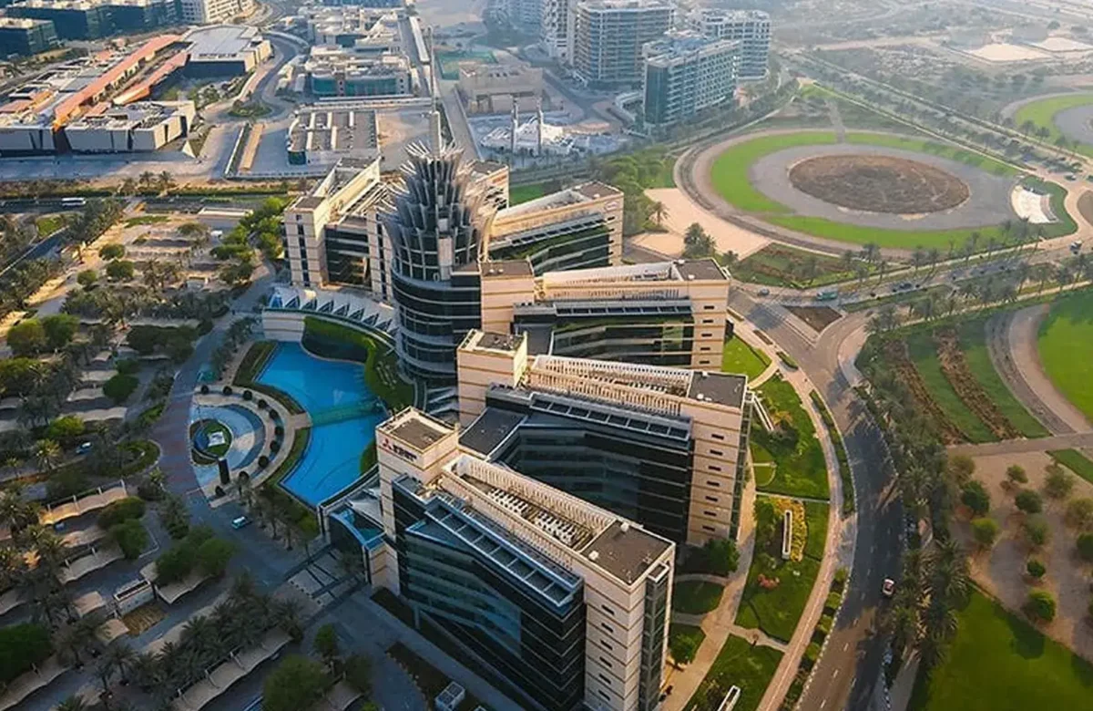 Aerial daytime view of Dubai Silicon Oasis headquarters and surrounding tech park infrastructure, representing prime commercial real estate by Casttio