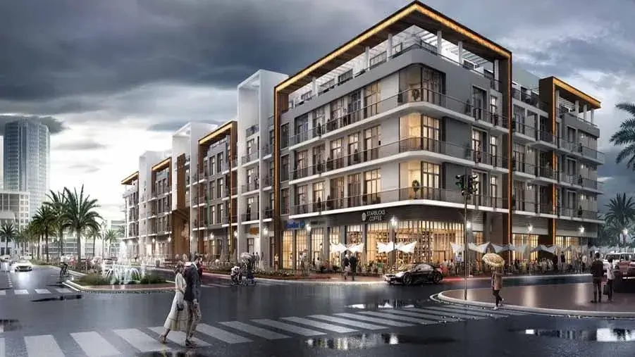 A modern mixed-use residential and commercial building with ground-floor retail shops, marketed by Casttio real estate